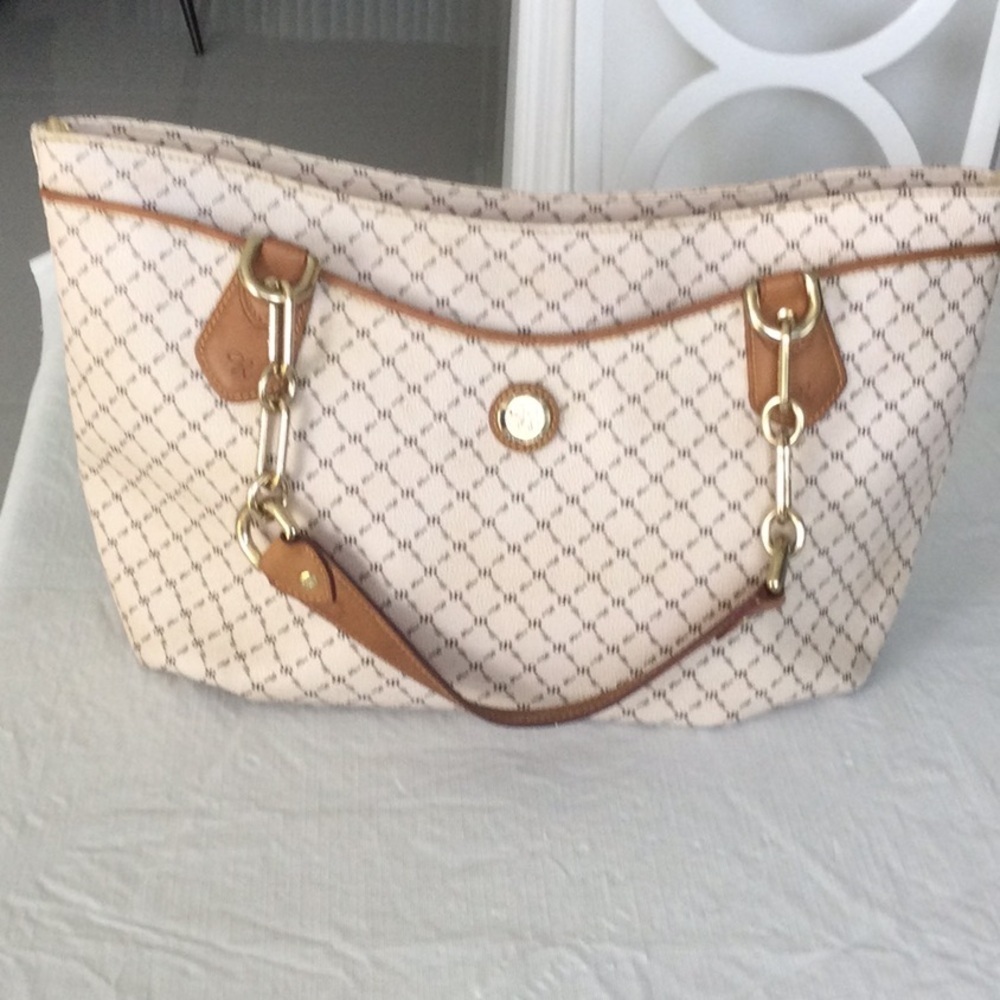 A Rioni Elegant Cream and Tan Monogram print and leather trim.